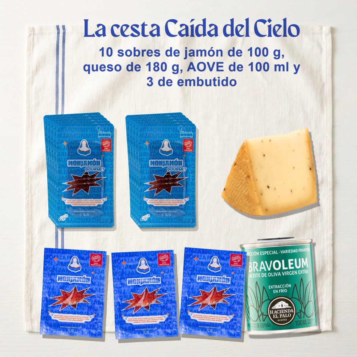 Cesta Caída del Cielo con Jamón de Bellota 100% Ibérico – lo que llega: 10 sobres de jamón de bellota de 100 g, una cuña de queso de 180 g, una lata de AOVE de 100 ml y 3 sobres de embutido de 50 g