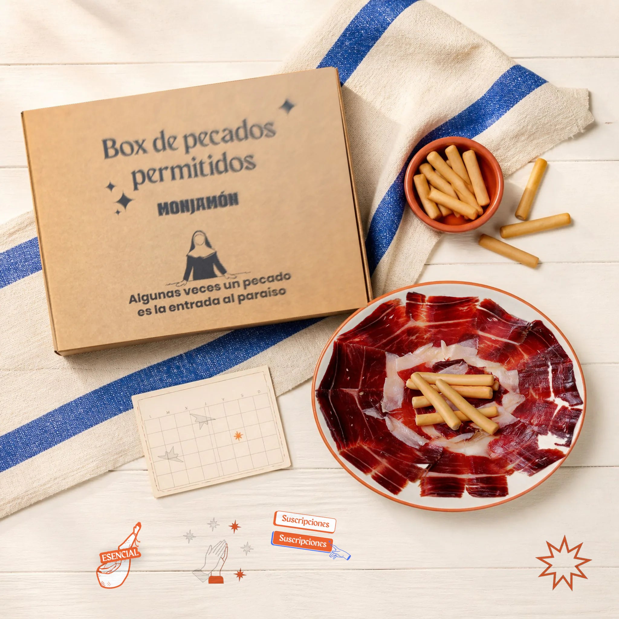 Monjamón +Lite - Suscripción a Jamón y embutido.. Desde 25€/Entrega – vista desde arriba: la caja de la suscripción junto a un plato de jamón y chorizo