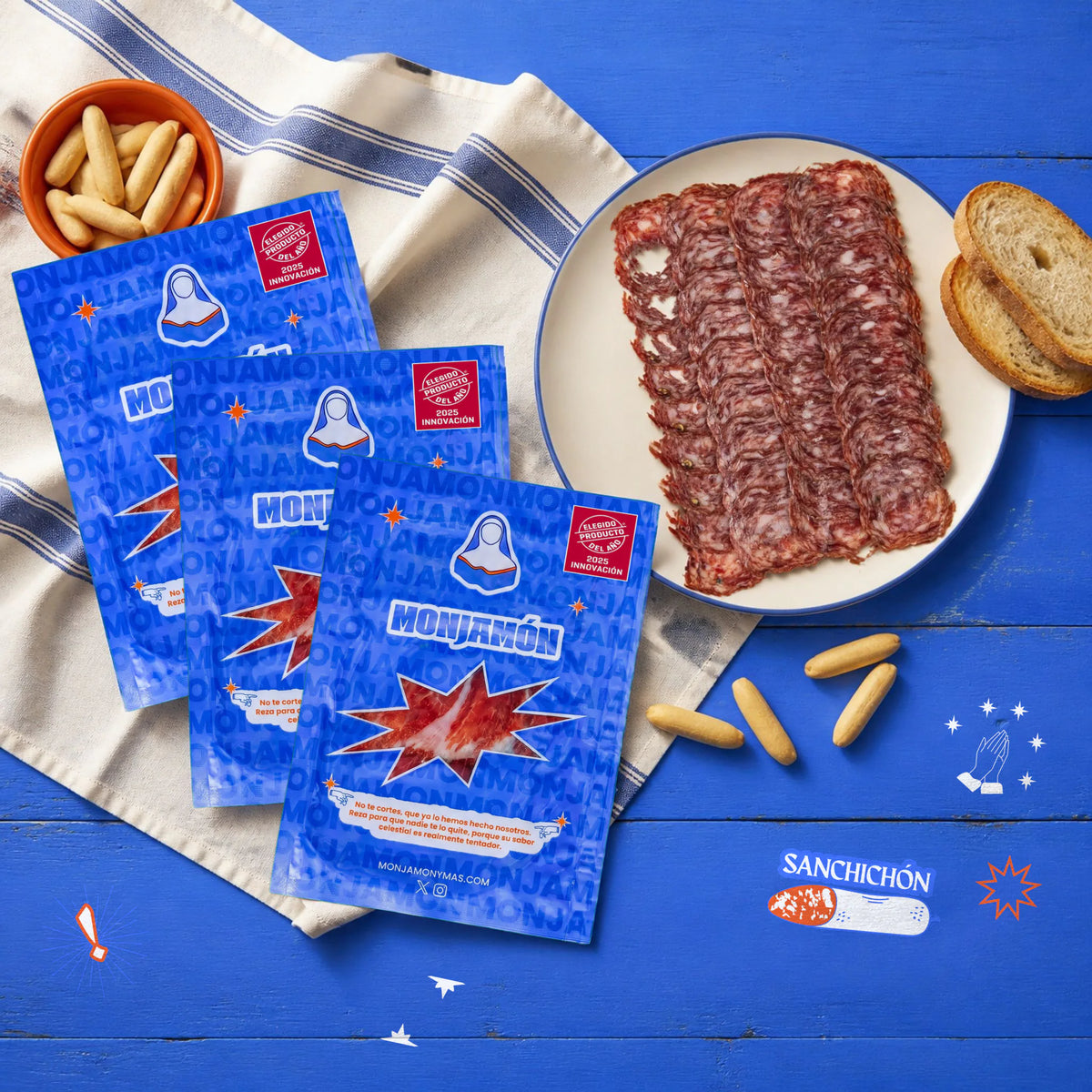 San chichón Loncheado · Salchichón de Bellota 100% Ibérico · 10 sobres de 50 g – vista desde arriba: un plato de San Chichón loncheado para compartir, con los sobres al lado